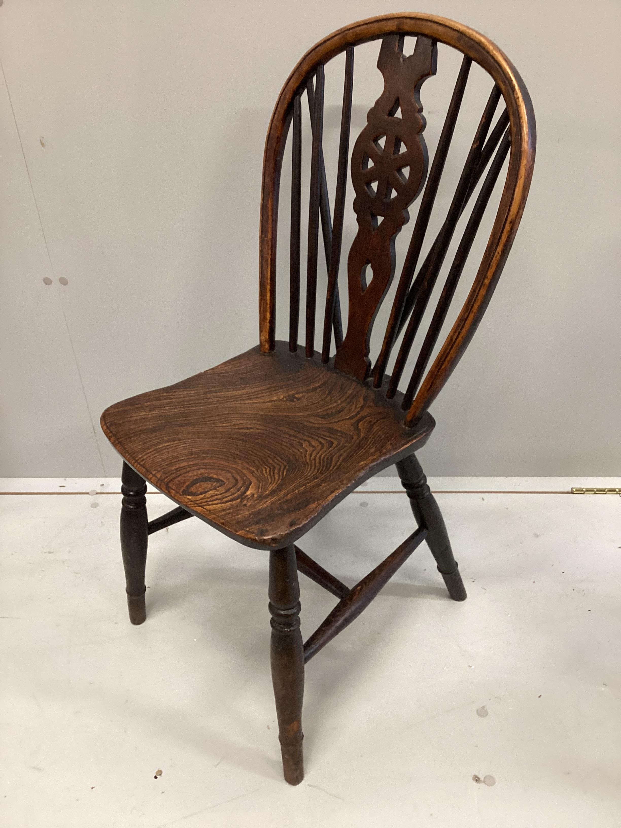 A harlequin set of four 19th century ash, elm and beech Windsor chairs